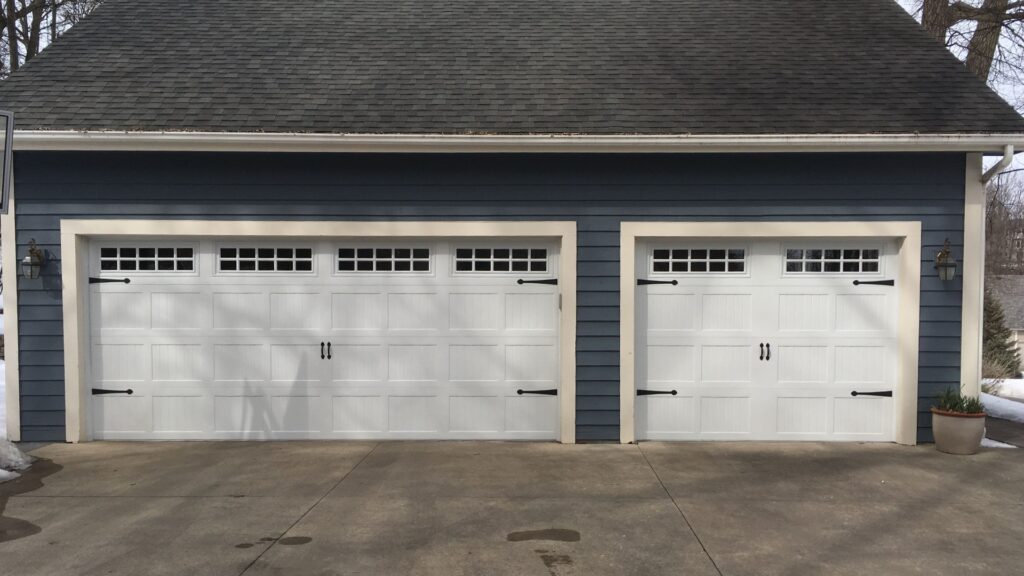 A residential garage door with garage door windows