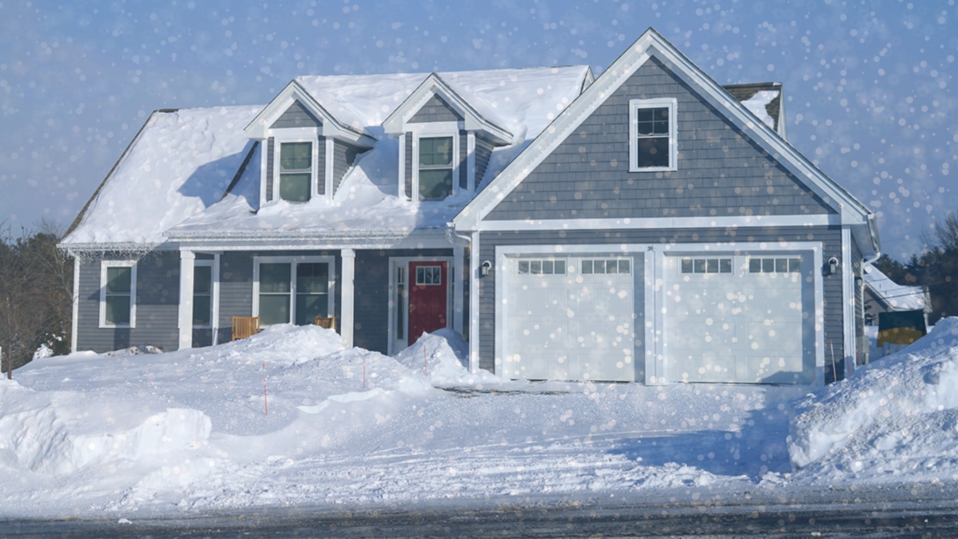 A house with a garage door during the winter