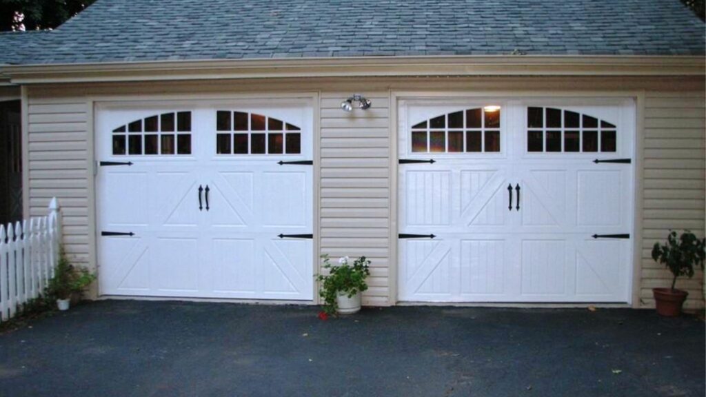 Two garage doors with decorative hardware