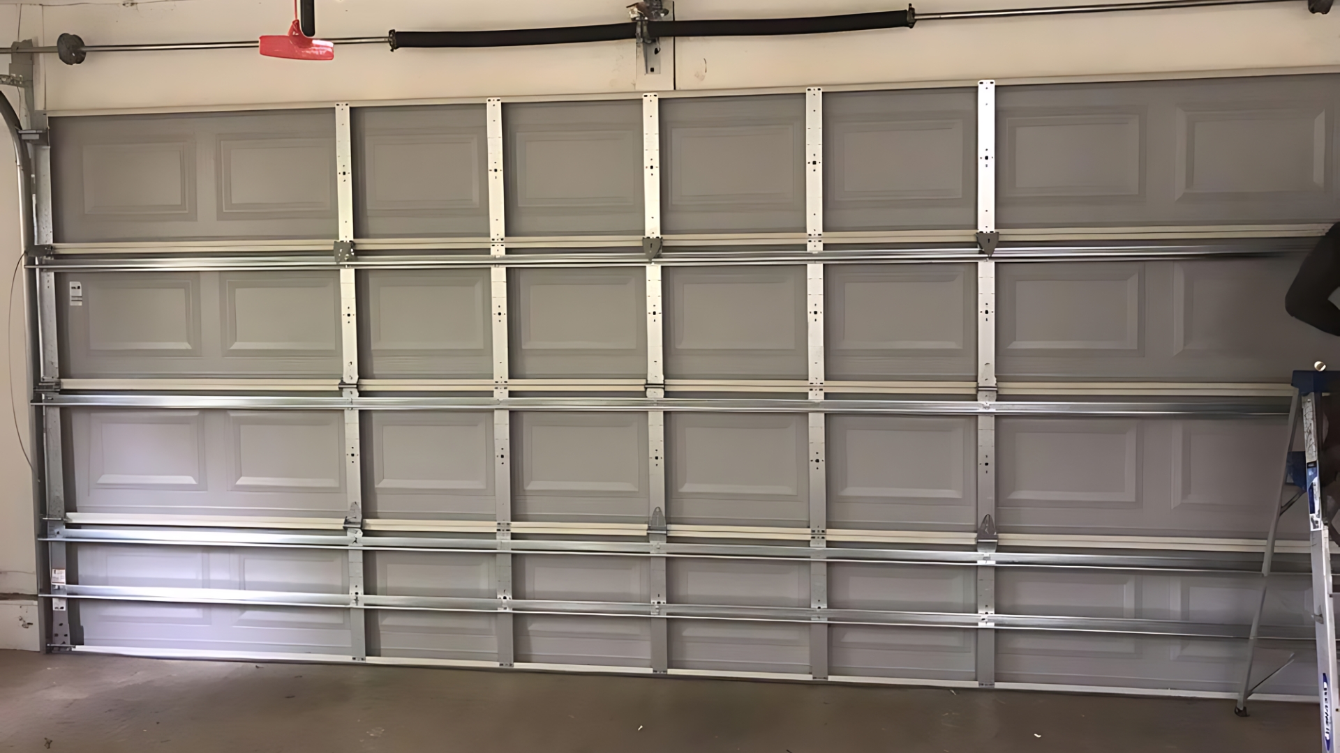 A residential garage door with braces