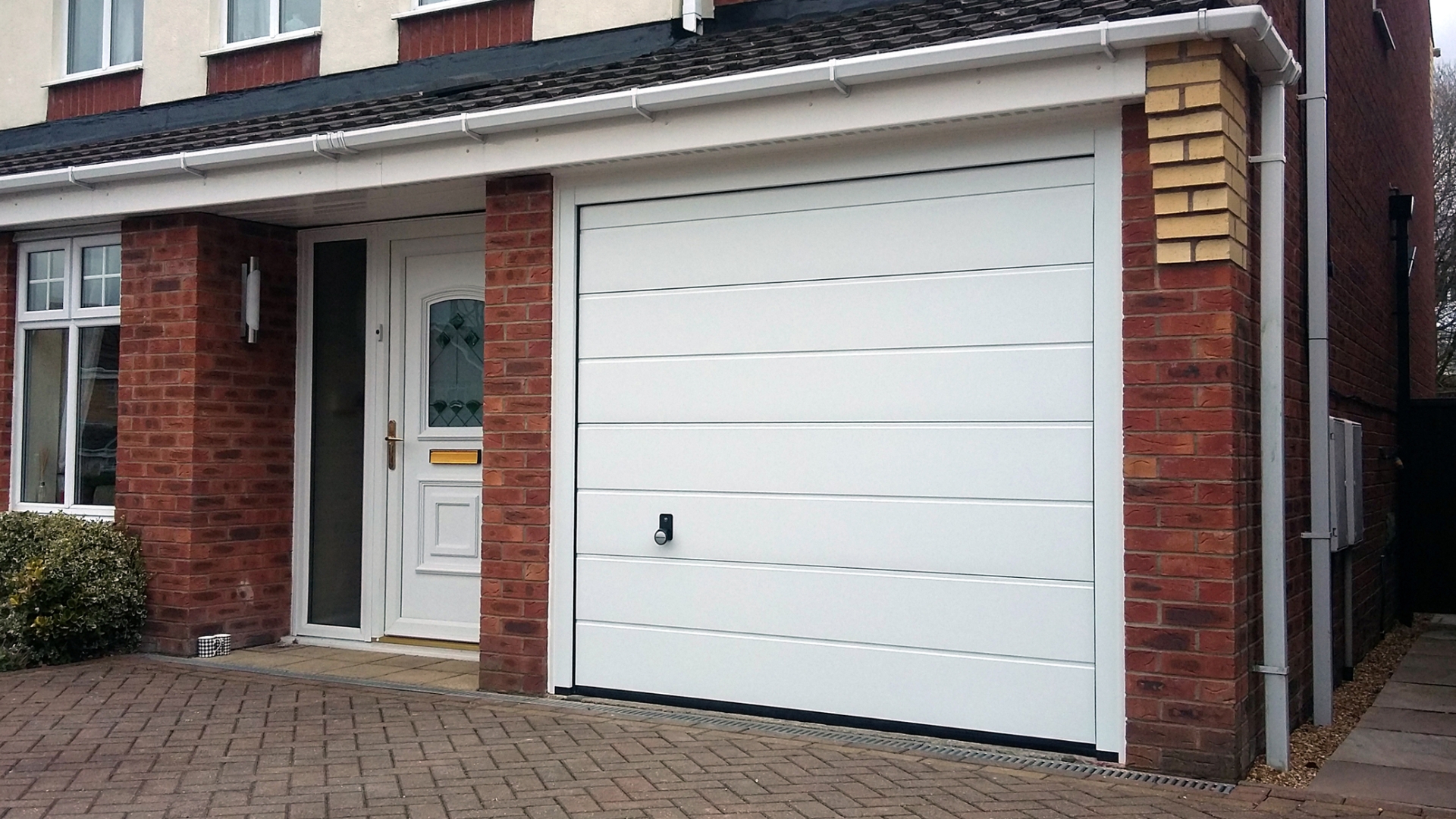 A home with white sectional garage door