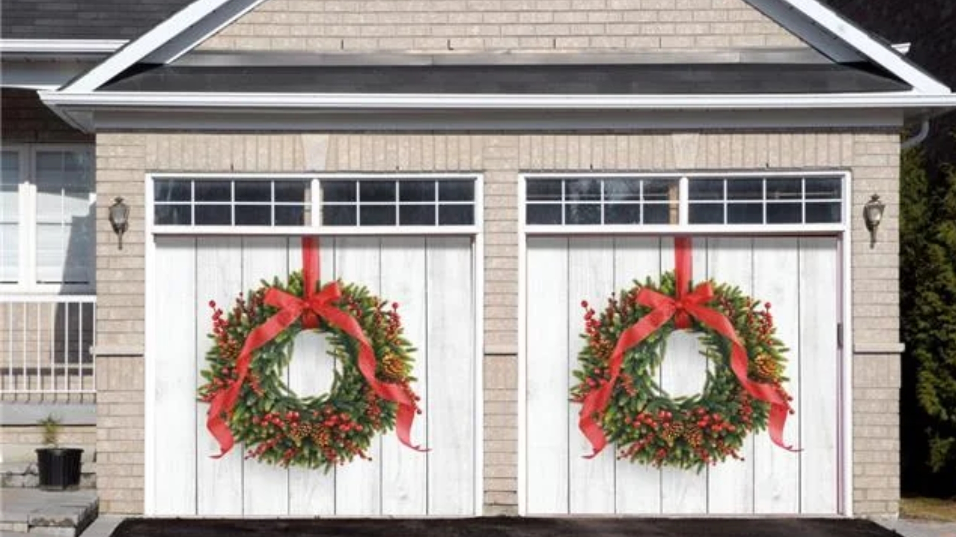 Two-car garage doors featuring festive holiday decor.