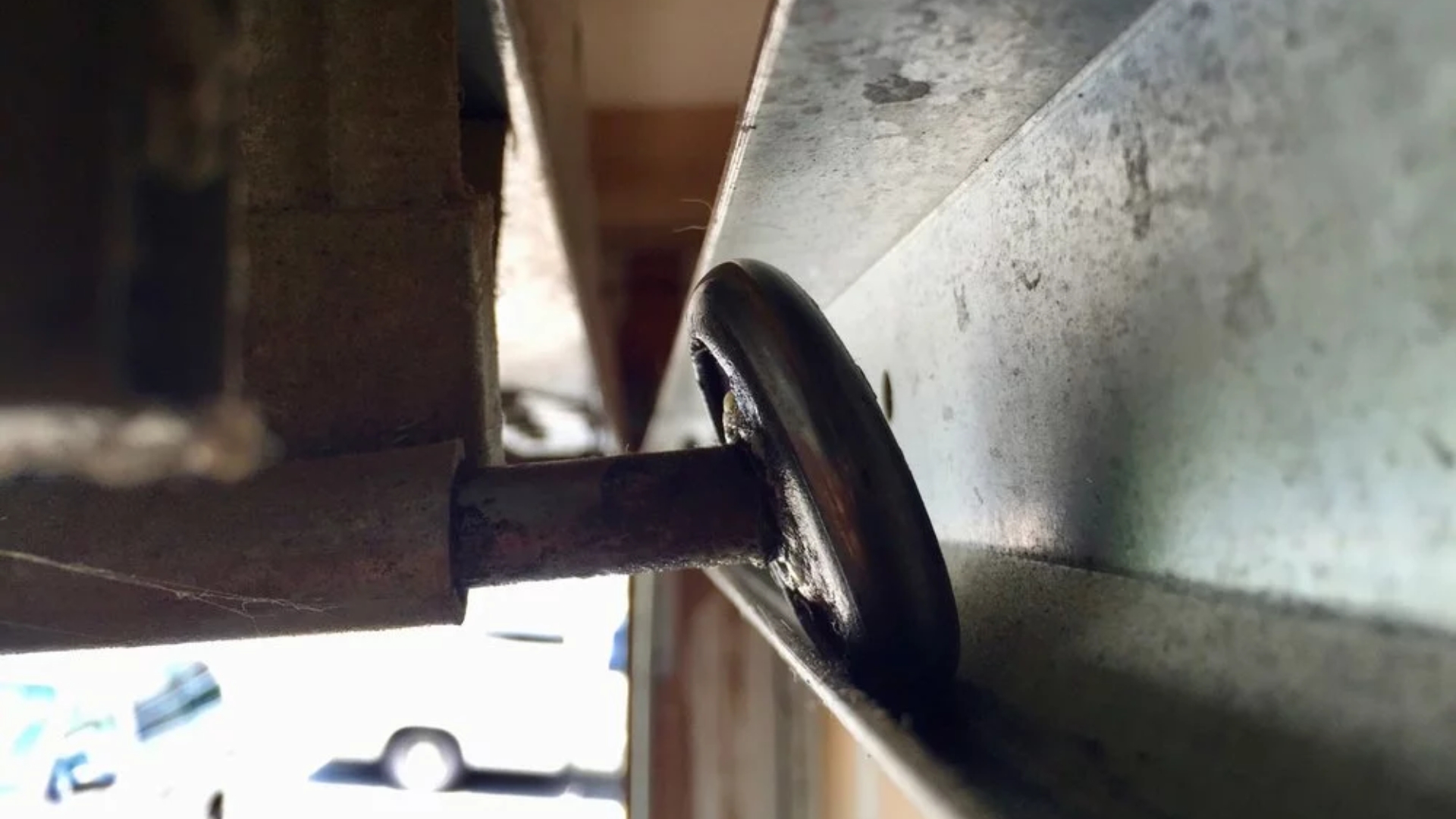 A worn-out garage door roller causing a slow garage door